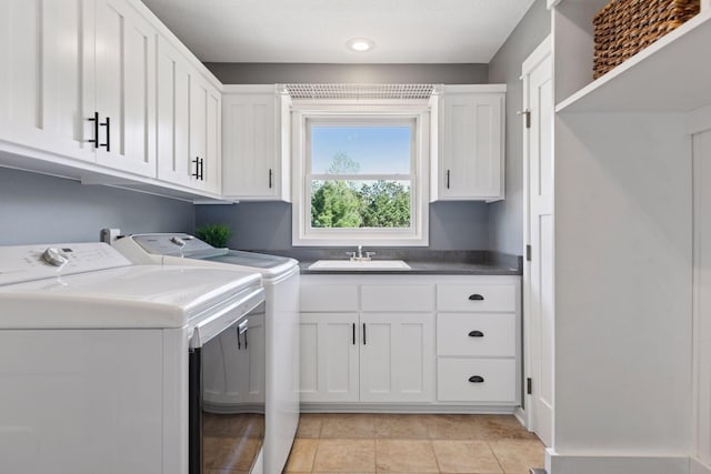 laundry area with cabinet space and independent washer and dryer