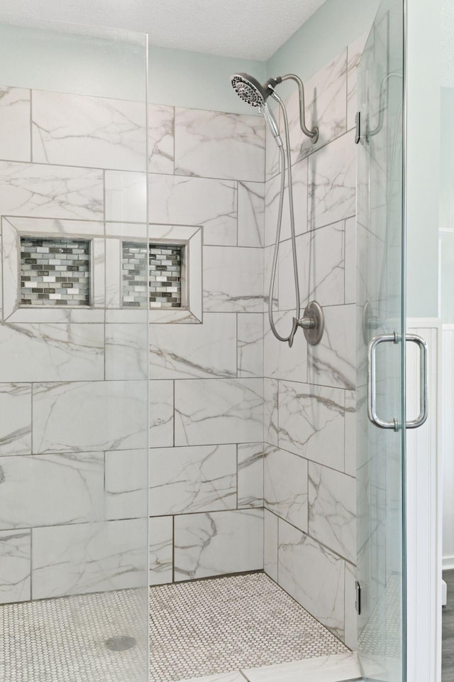 bathroom with a shower stall