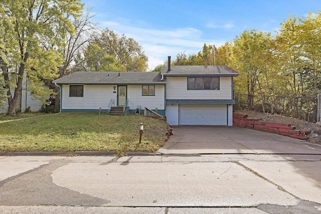 view of front facade with a garage and a front lawn