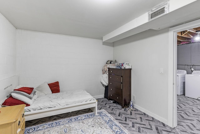 bedroom featuring separate washer and dryer