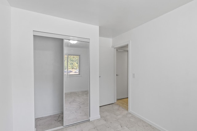 unfurnished bedroom featuring a closet