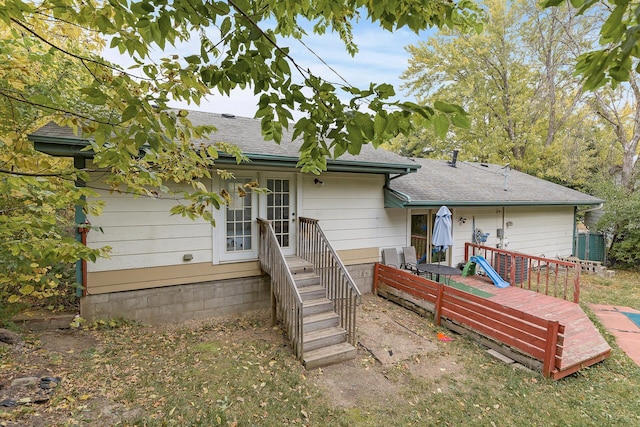 back of property featuring a wooden deck