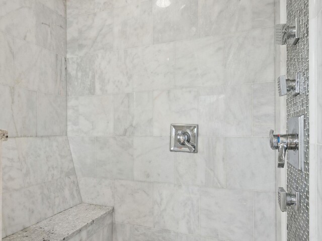 full bathroom with tiled shower