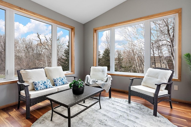 sunroom featuring lofted ceiling