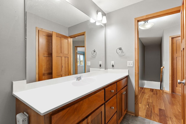 bathroom with wood-type flooring and vanity