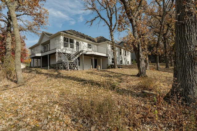 rear view of property with a wooden deck