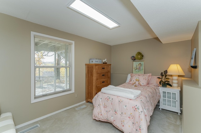 bedroom with light carpet