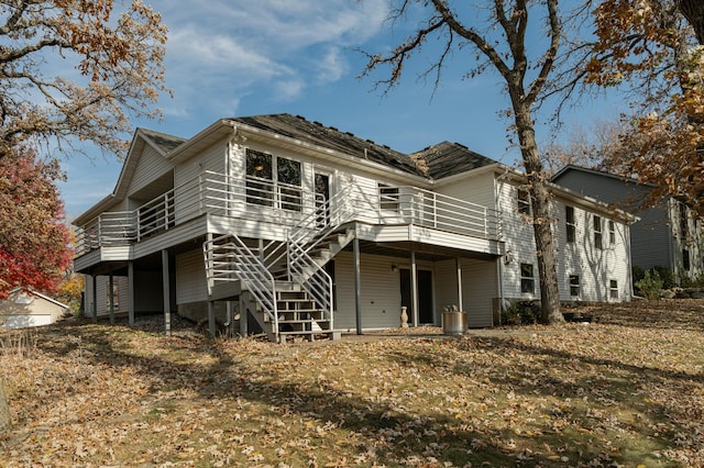 back of property featuring a wooden deck