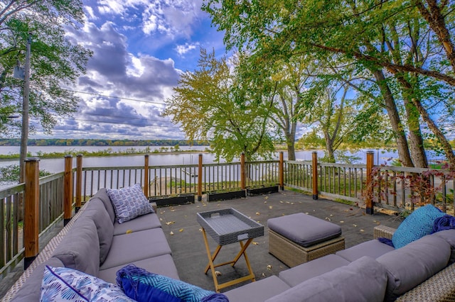 wooden terrace featuring outdoor lounge area and a water view