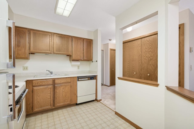 kitchen with sink, dishwasher, and range