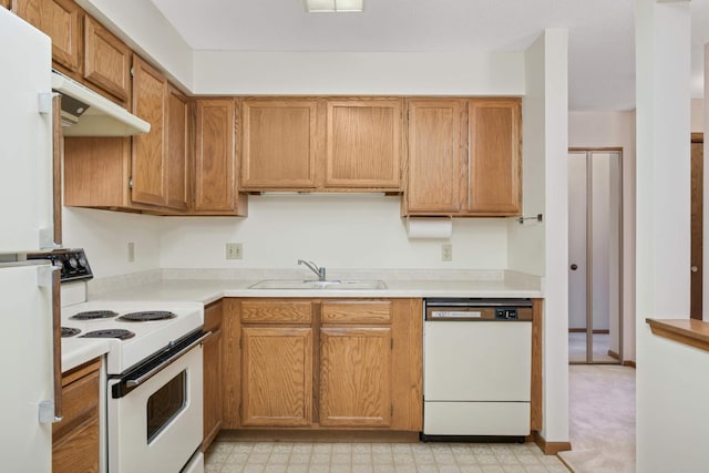 kitchen with sink and white appliances