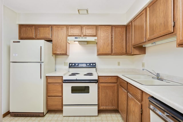 kitchen with sink and white appliances