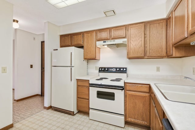 kitchen featuring sink and white appliances