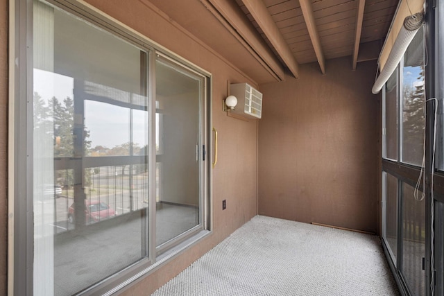 sunroom featuring beamed ceiling