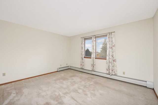 carpeted empty room with a baseboard radiator