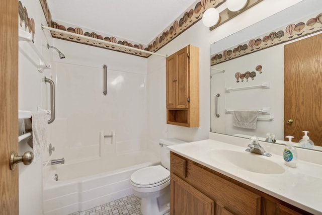 full bathroom featuring vanity, tub / shower combination, and toilet