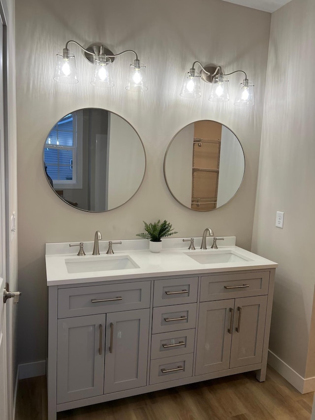 bathroom with vanity and hardwood / wood-style flooring