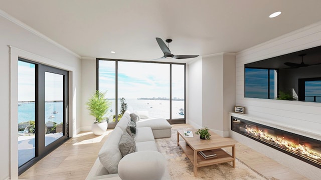 living room featuring ornamental molding, a water view, ceiling fan, and hardwood / wood-style floors