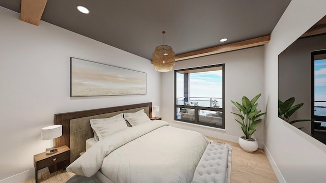 bedroom with beam ceiling and light wood-type flooring