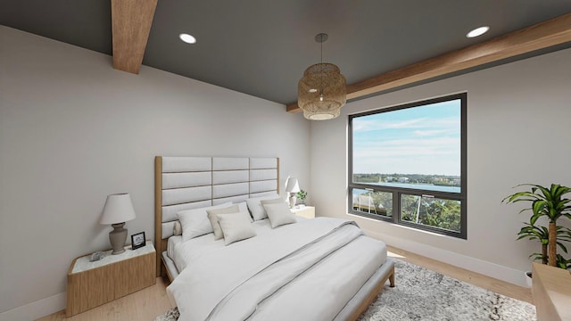 bedroom featuring beamed ceiling and wood-type flooring