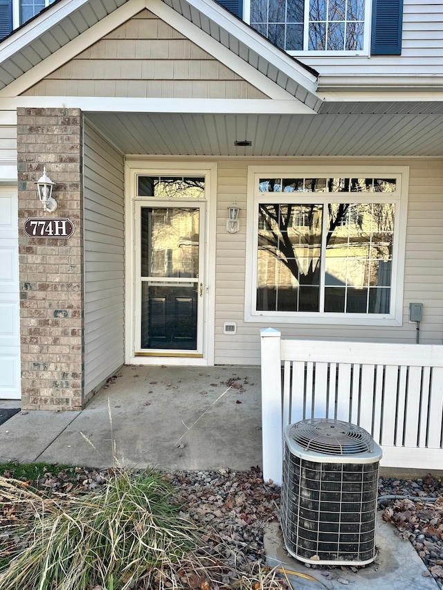 property entrance featuring central AC