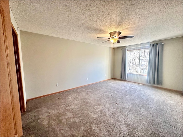 carpeted empty room with a textured ceiling and ceiling fan