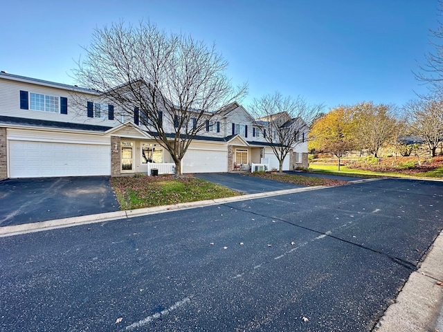 front of property with a garage