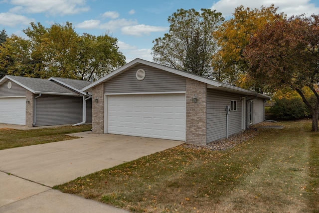 view of front of property with a garage and a front yard