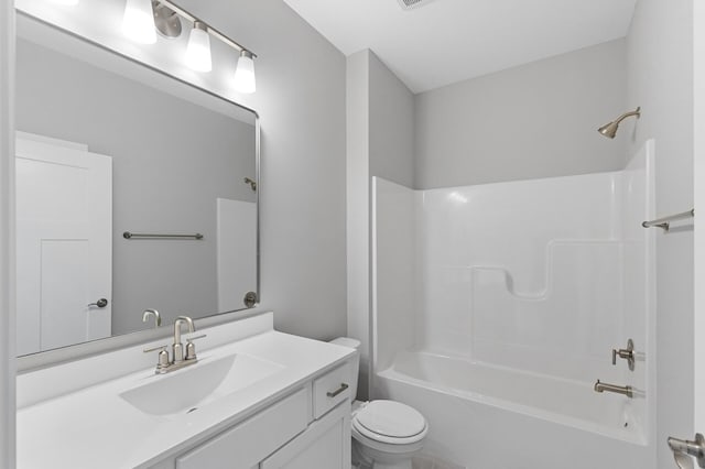 full bathroom featuring vanity, toilet, and shower / tub combination