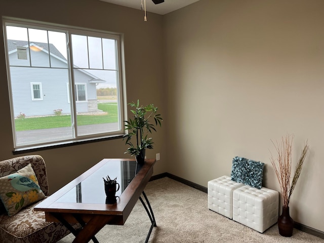 office featuring ceiling fan, light carpet, and a wealth of natural light