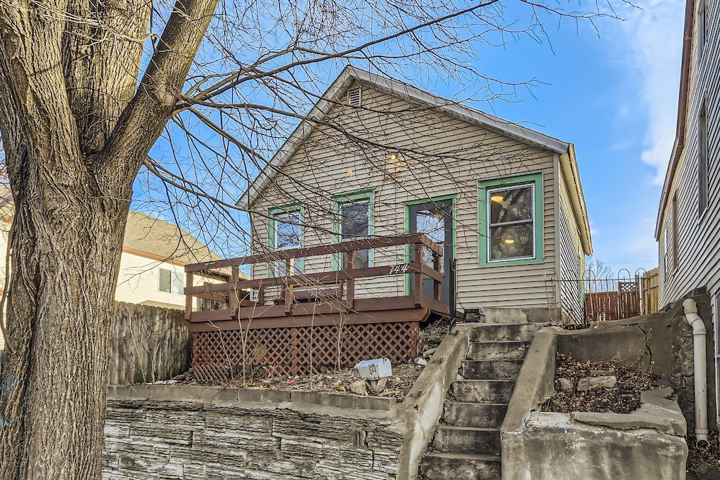 rear view of property with a deck