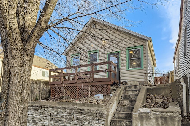 rear view of property with a deck