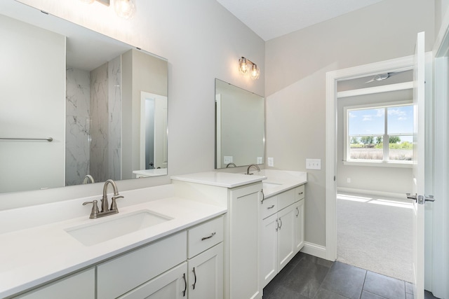 bathroom featuring tile patterned flooring and vanity