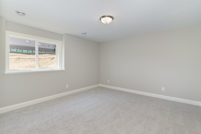 unfurnished room with carpet flooring