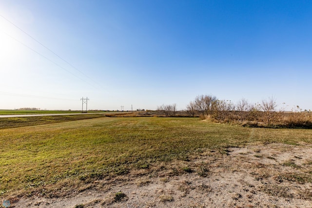 view of yard with a rural view