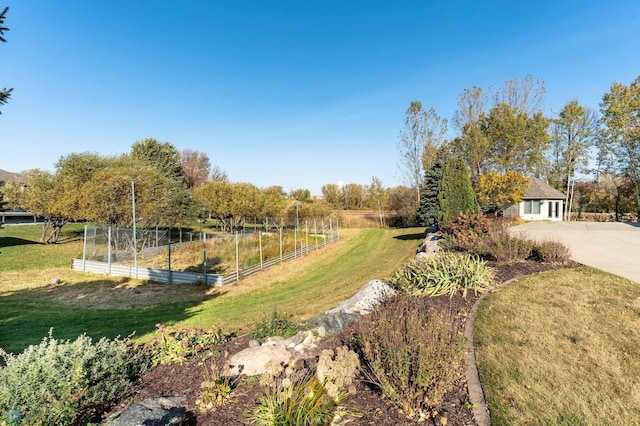 exterior space featuring a lawn and a rural view