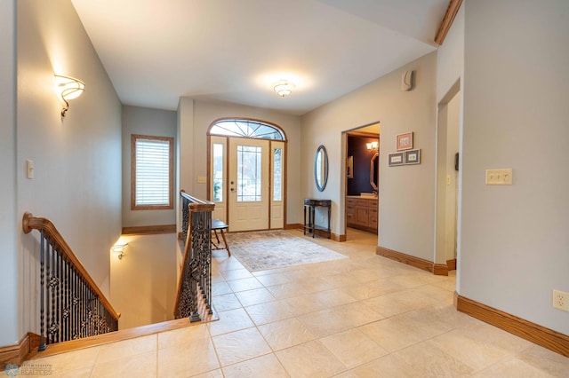 entryway with light tile patterned flooring