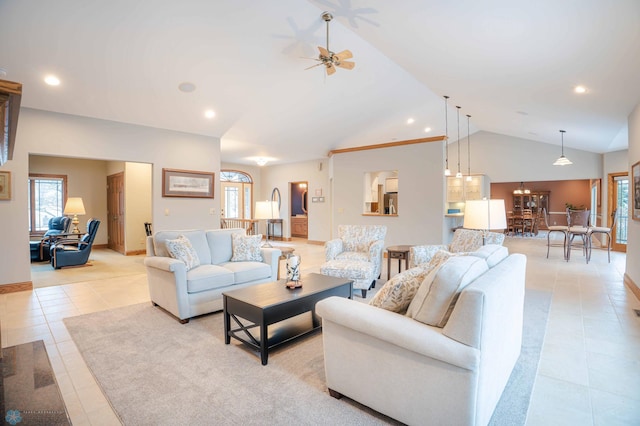 living room featuring ceiling fan, light tile patterned floors, and vaulted ceiling