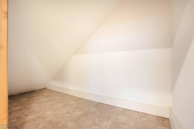 bonus room featuring vaulted ceiling