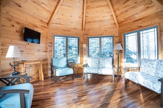 sitting room featuring hardwood / wood-style flooring, beam ceiling, and high vaulted ceiling