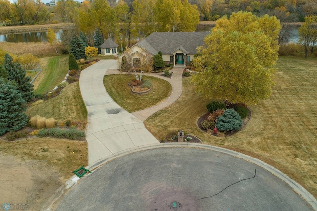 birds eye view of property with a water view