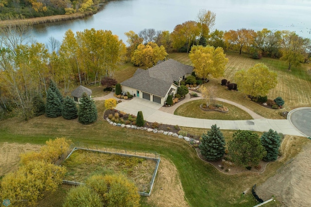 birds eye view of property with a water view