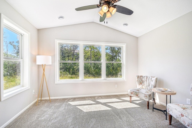 sitting room featuring lofted ceiling, ceiling fan, and light carpet