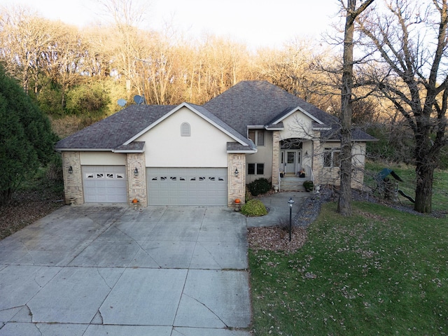 view of front facade with a front lawn and a garage