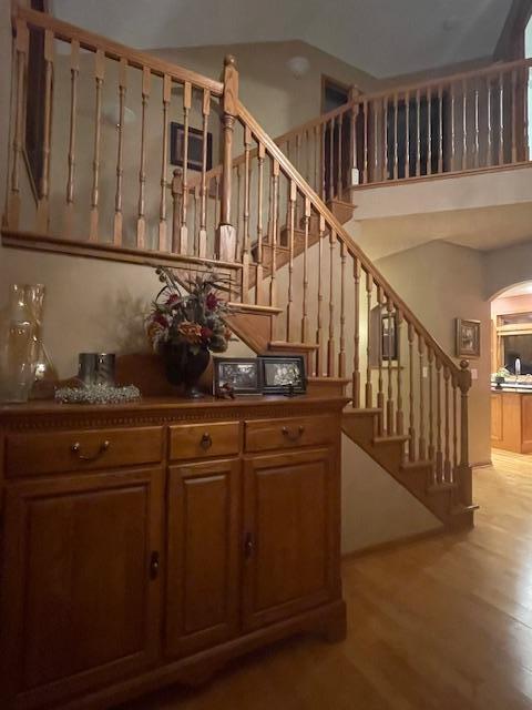 stairs with wood-type flooring