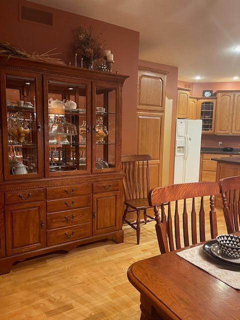 dining area with light hardwood / wood-style flooring