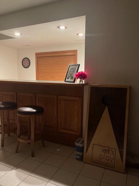 bar with light tile patterned floors