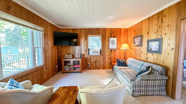 living room featuring wood ceiling, wood walls, and carpet flooring