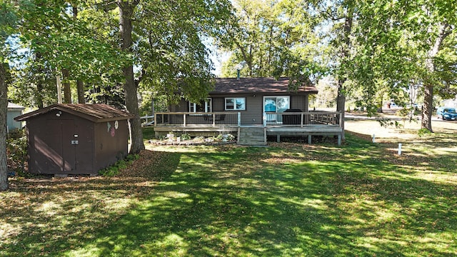 view of yard featuring a deck and a shed