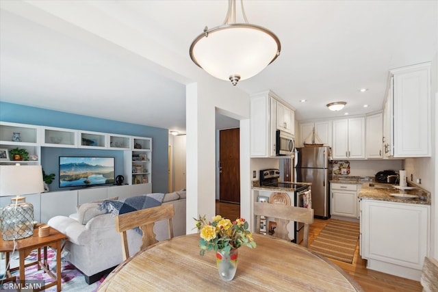 dining room with light wood-type flooring